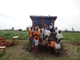 Group photo in front of toilets